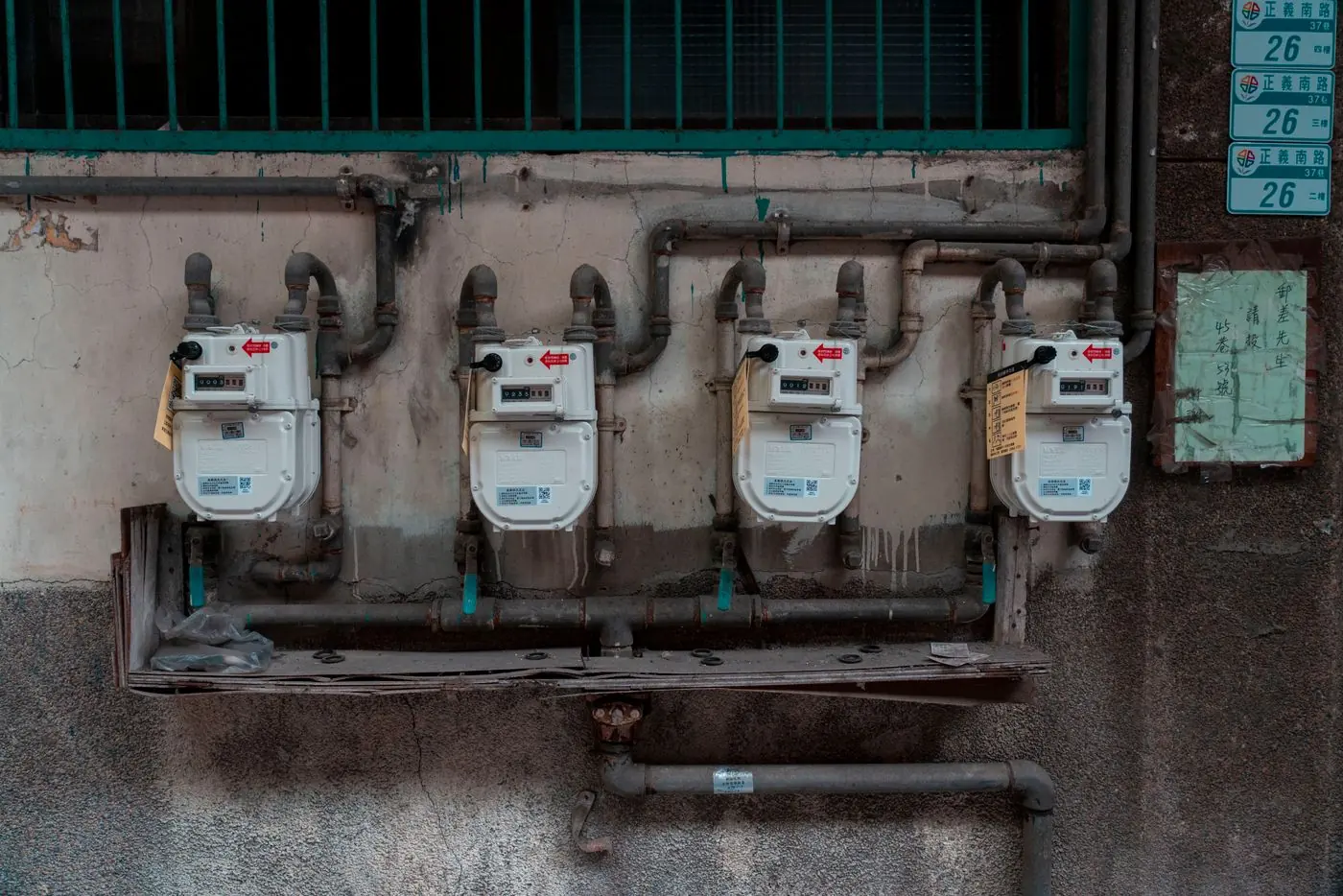 Natural gas meters and piping on a wall