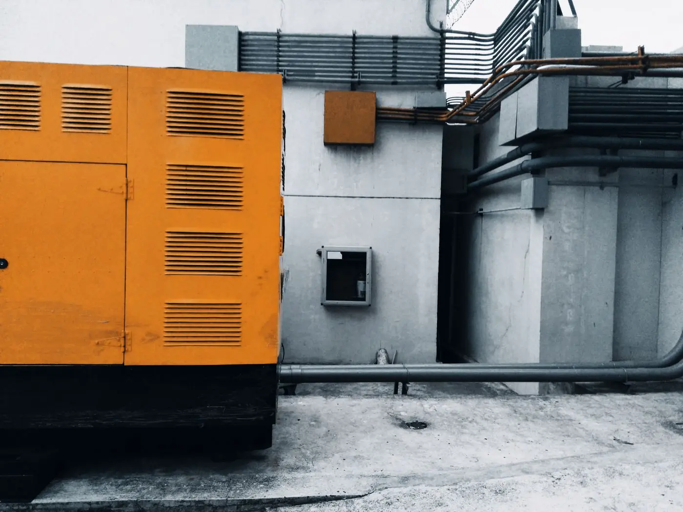 Standby generator unit installed beside a building