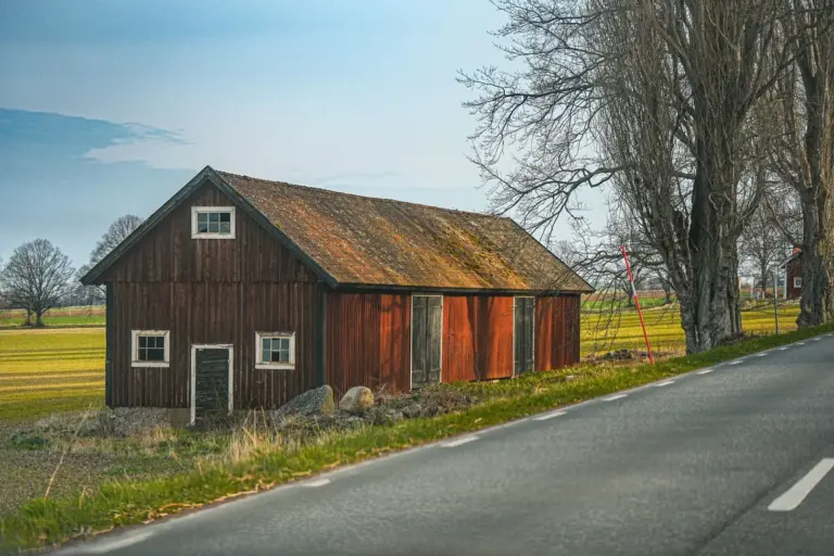 Red barn beside a country road