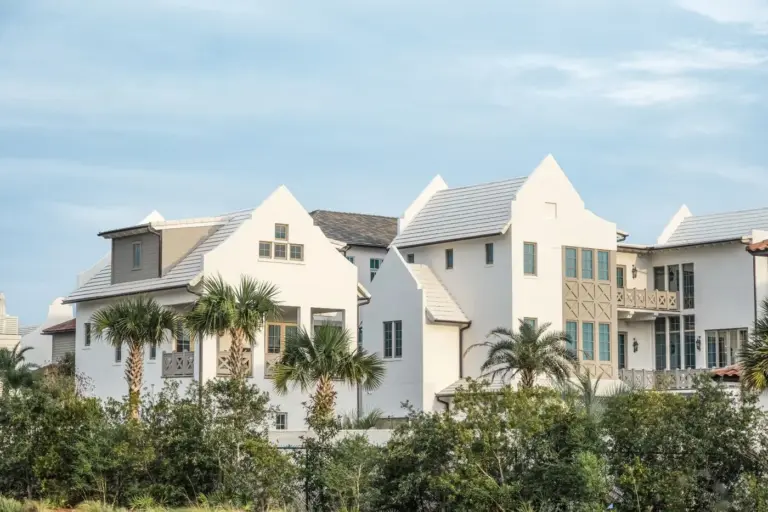 Row of homes with palm trees in front