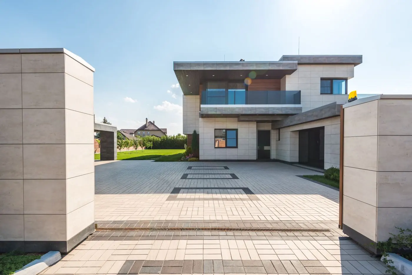 Modern two-story home exterior with a landscaped yard