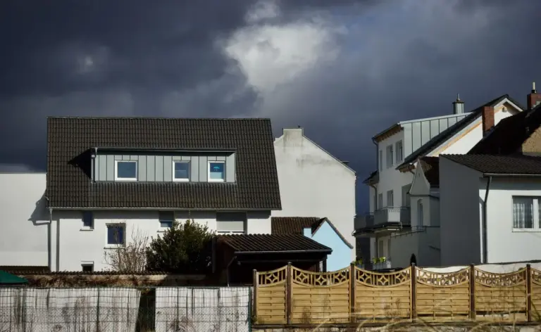 Dark storm sky over suburban houses