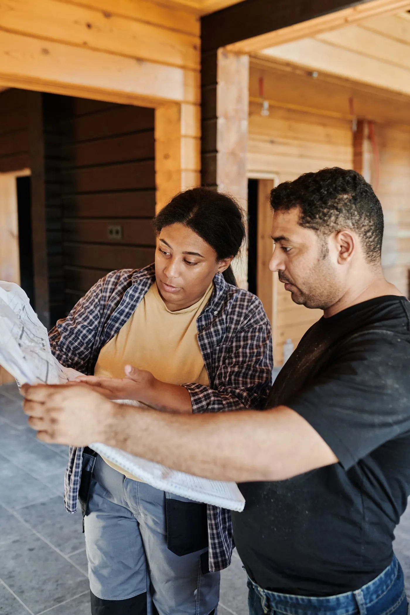 Contractor and homeowner reviewing plans