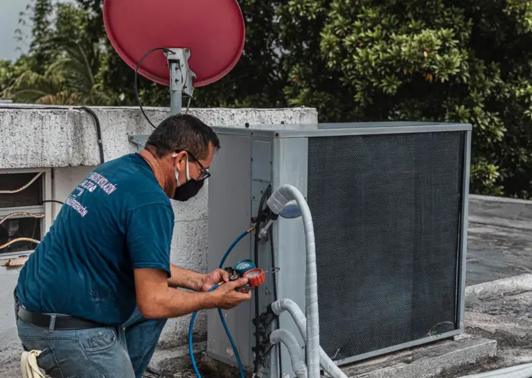 Technician checking an outdoor mechanical unit